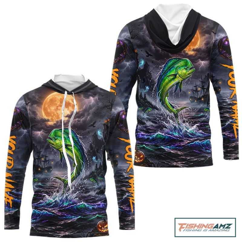 A long-sleeve hoodie with an all-over Halloween-themed graphic print featuring a green mahi-mahi fish jumping from dark ocean waves under a large orange full moon, with spooky ships and lightning in the background. The hoodie has white drawstrings and a white inner hood lining, shown on a plain white background with a FishingAmz logo in the top right corner.