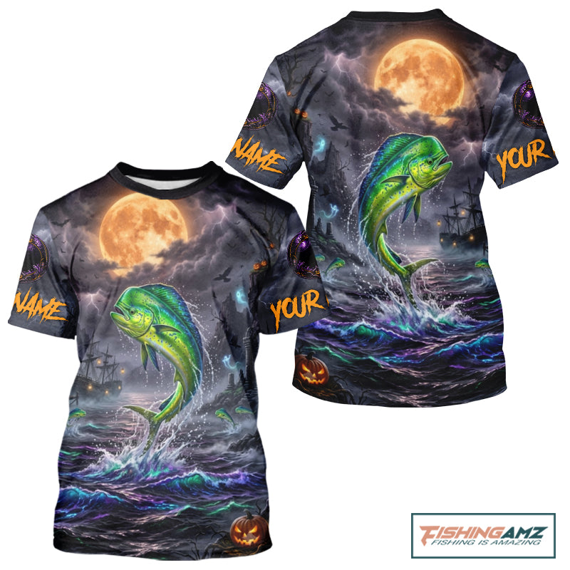 A short-sleeve crewneck t-shirt featuring a full-bleed Halloween graphic print. The design depicts a green and yellow mahi-mahi fish jumping from dark, stormy ocean waves under a large orange full moon, with a ghost ship in the background and customizable text placeholders 'NAME' and 'YOUR' on the sleeves.