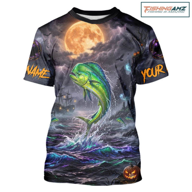 A short-sleeve crewneck t-shirt featuring a full-bleed Halloween graphic print. The design depicts a green and yellow mahi-mahi fish jumping from dark, stormy ocean waves under a large orange full moon, with a ghost ship in the background and customizable text placeholders 'NAME' and 'YOUR' on the sleeves.