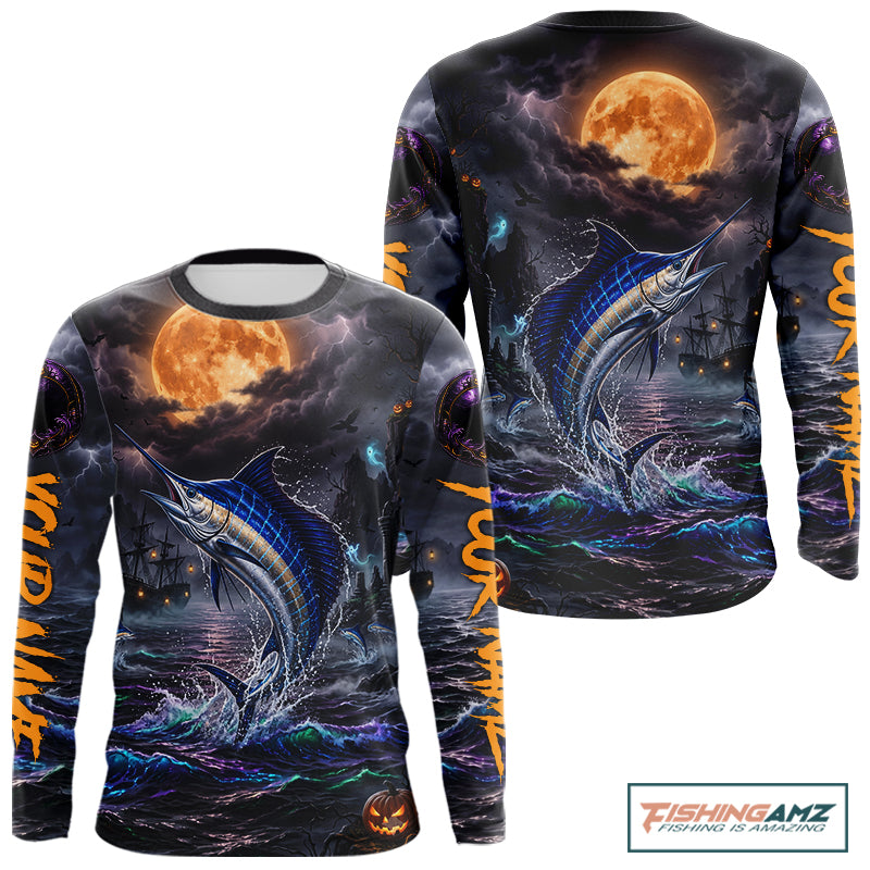 A long-sleeve crewneck shirt with an all-over Halloween-themed graphic print featuring a jumping blue marlin under a full moon, dark stormy seas, and orange text on the sleeves, shown on a white background with a FishingAmz logo in the top right corner.