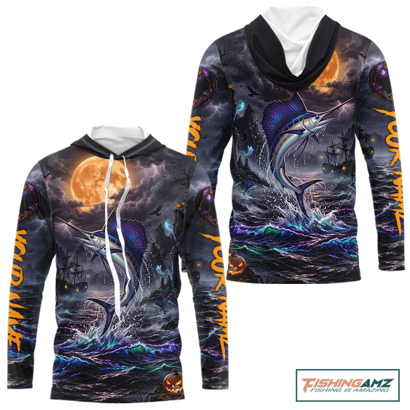 A long-sleeve hoodie with a detailed Halloween-themed graphic print featuring a marlin jumping from stormy waters under a large full moon, with orange text down the sleeves and a pumpkin jack-o'-lantern near the hem. The hoodie is shown on a plain white background with a 'FishingAmz' logo in the top right corner