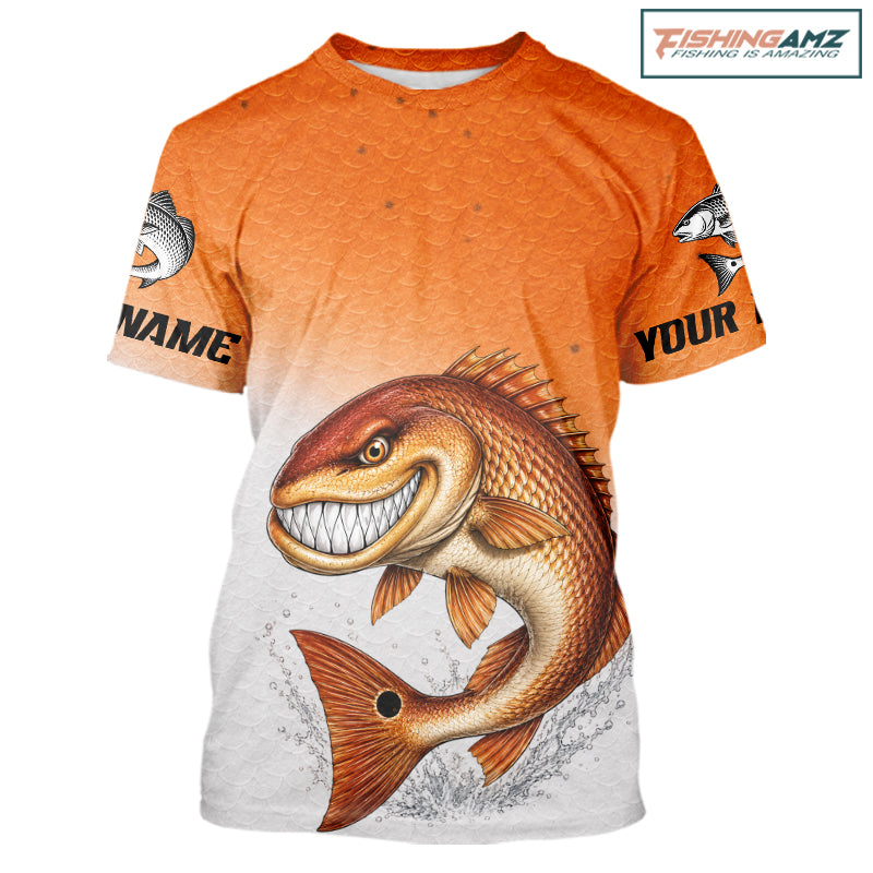 An orange-to-white gradient graphic t-shirt featuring a large cartoon-style smiling fish jumping across the front. The shirt has placeholder text on the sleeves ('NAME' and 'YOUR') and a 'ChipteeAmz' logo watermark in the top right corner.