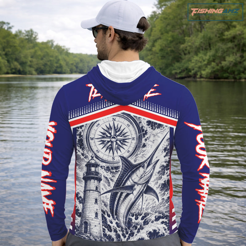 Angler wearing personalized Marlin blue long sleeve hooded performance fishing shirt on the water