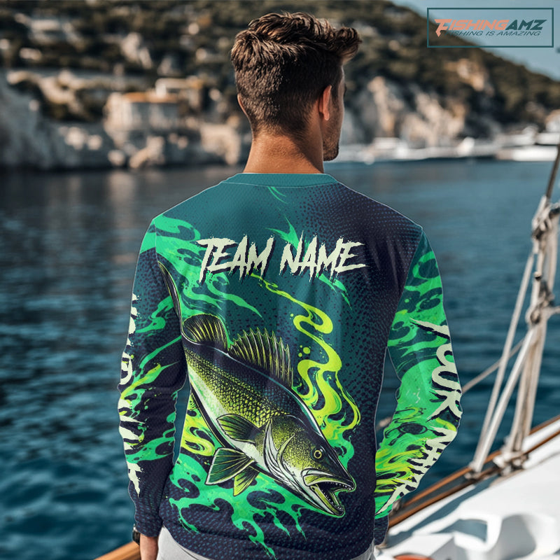 Angler wearing custom Walleye fishing green camo long sleeve shirt on the water with personalized name