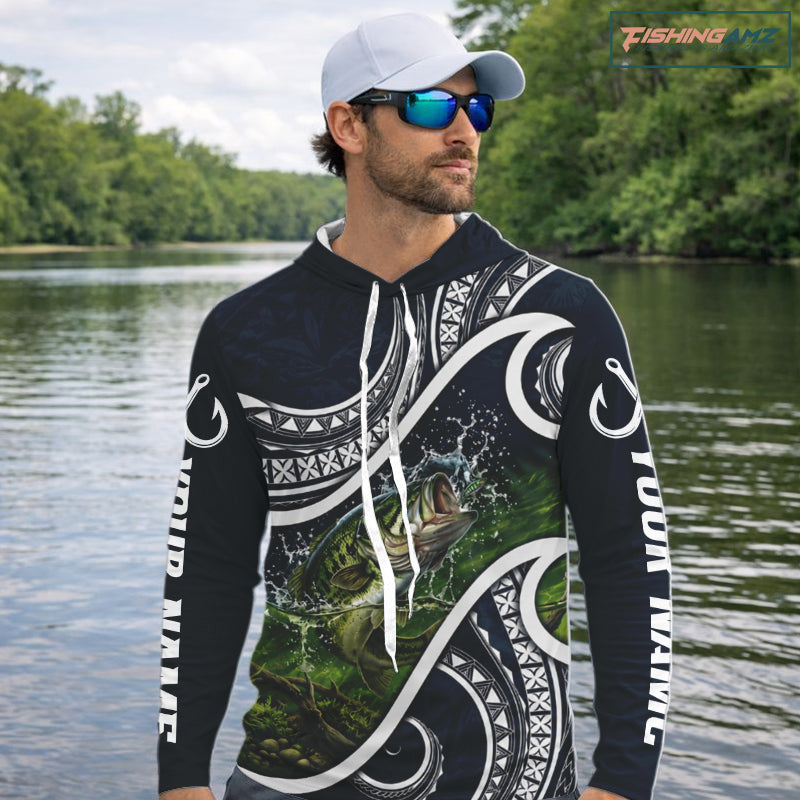 Angler wearing blue tribal pattern custom largemouth bass long sleeve hooded fishing shirt on the water