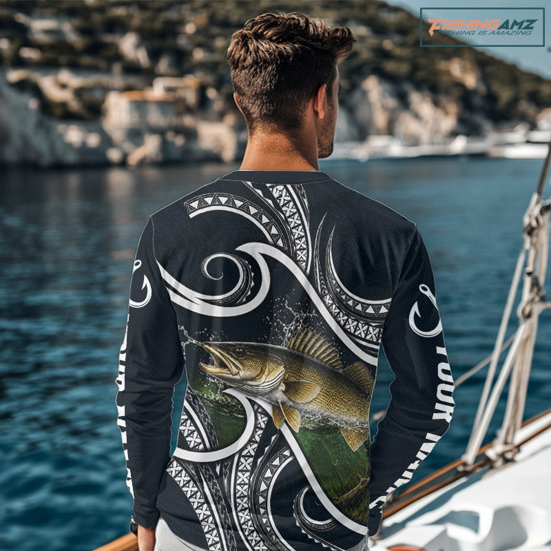 Angler wearing blue tribal pattern custom walleye long sleeve fishing shirt on the water