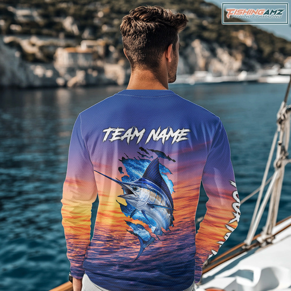 Angler wearing Marlin Fishing Sunset custom long sleeve marlin offshore fishing shirt on the boat at sunset with personalized name on the back.