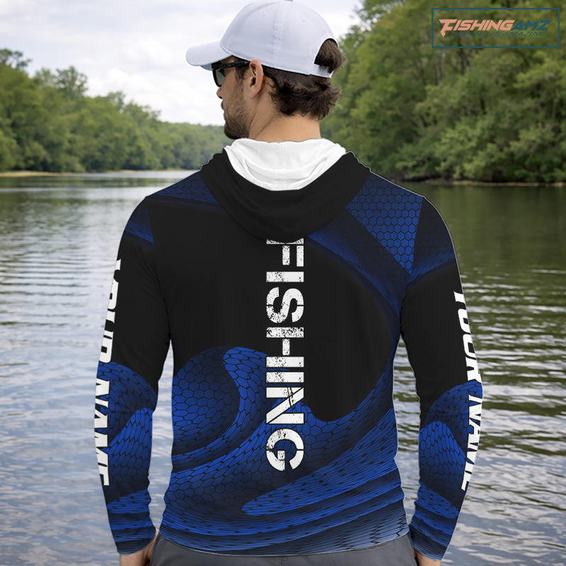 Angler wearing personalized camo bass fishing hooded long sleeve shirt while fishing
