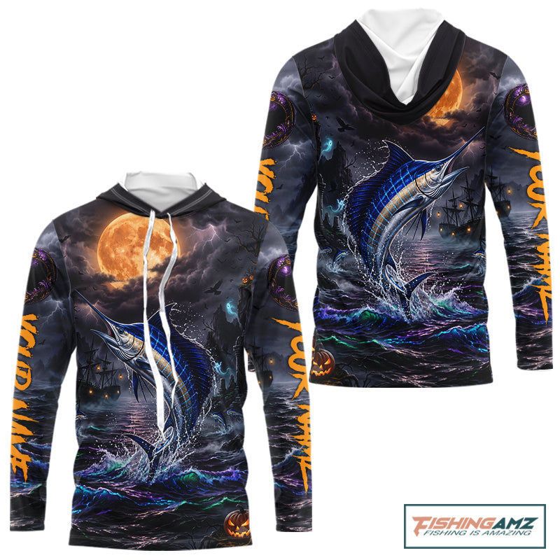 A long-sleeve hoodie with an all-over Halloween-themed graphic print featuring a jumping marlin, stormy seas, a full moon, and orange text down the sleeves, shown on a white background with a FishingAmz logo in the top right corner.