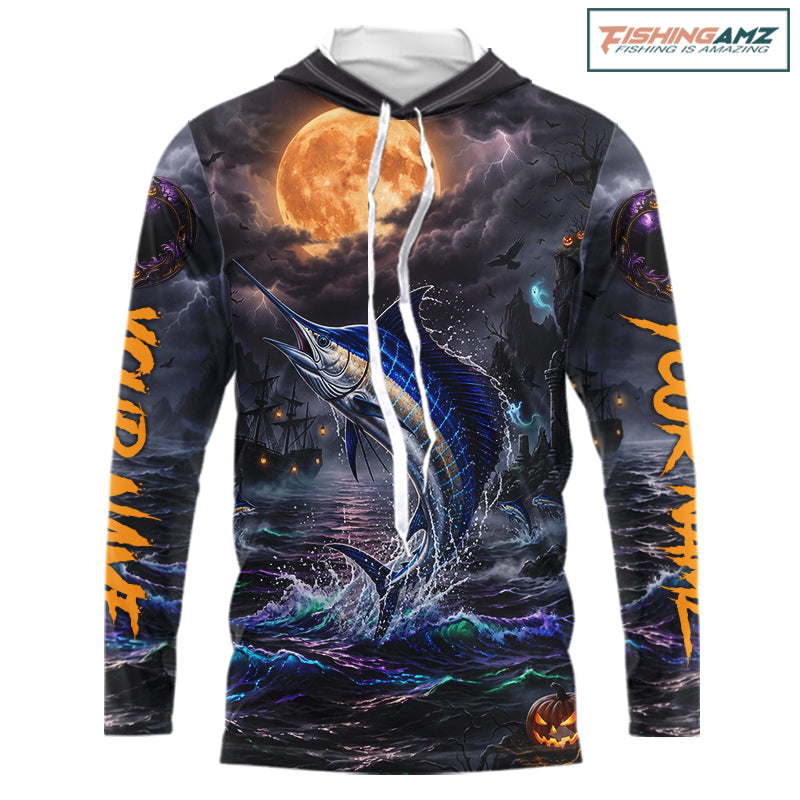 A long-sleeve hoodie with an all-over Halloween-themed graphic print featuring a jumping marlin, stormy seas, a full moon, and orange text down the sleeves, shown on a white background with a FishingAmz logo in the top right corner.