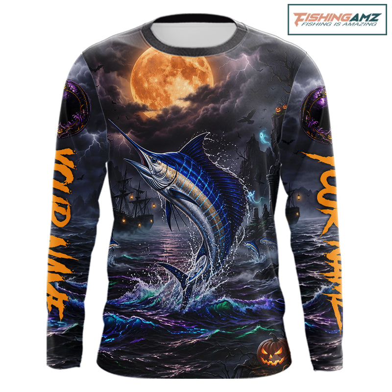 A long-sleeve crewneck shirt with an all-over Halloween-themed graphic print featuring a jumping blue marlin under a full moon, dark stormy seas, and orange text on the sleeves, shown on a white background with a FishingAmz logo in the top right corner.