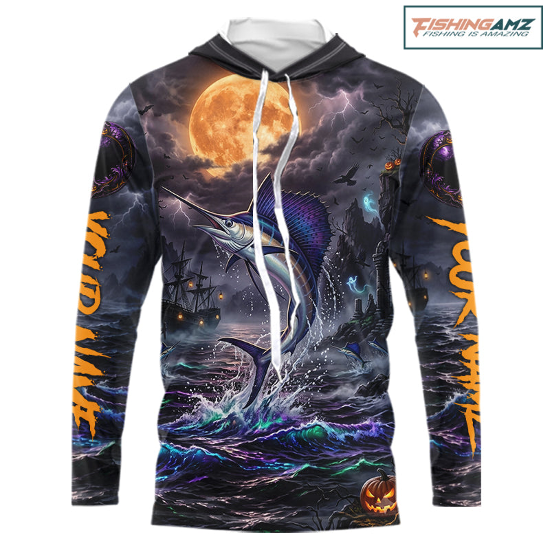 A long-sleeve hoodie with a detailed Halloween-themed graphic print featuring a marlin jumping from stormy waters under a large full moon, with orange text down the sleeves and a pumpkin jack-o'-lantern near the hem. The hoodie is shown on a plain white background with a 'FishingAmz' logo in the top right corner.