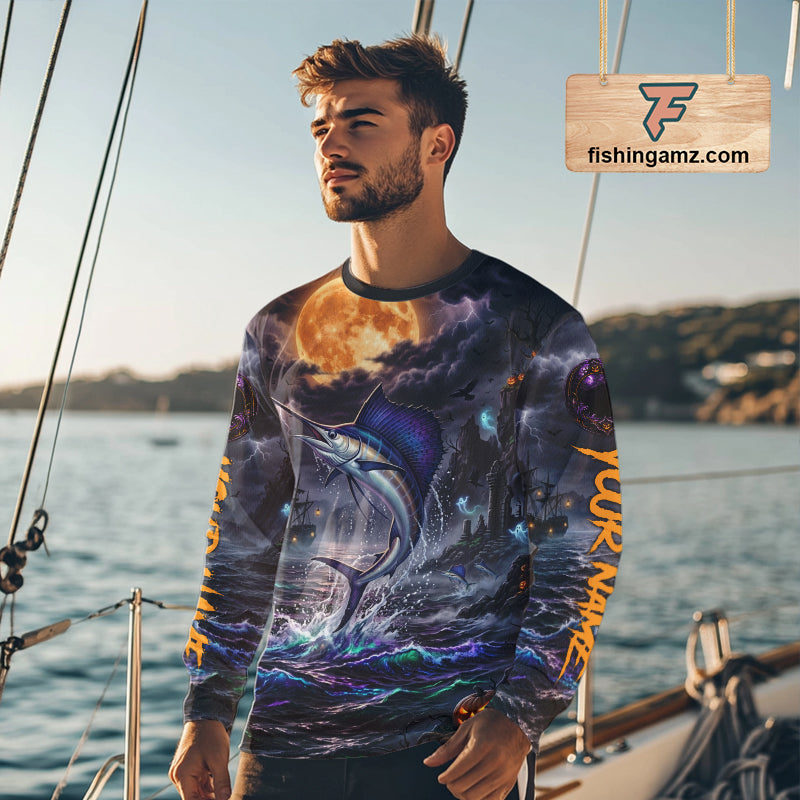A man wearing a long-sleeve crewneck shirt with an all-over Halloween-themed graphic print featuring a marlin, full moon, and haunted house