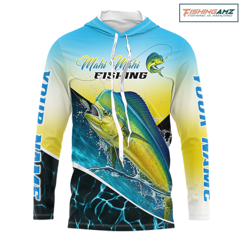 A long-sleeve hooded shirt with an all-over Mahi Mahi fishing graphic, featuring a large marlin fish, blue and yellow gradient background, and white drawstrings