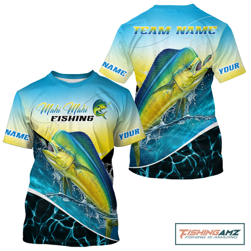 A short-sleeve graphic t-shirt featuring a Mahi Mahi fishing design. The shirt has a blue-to-yellow gradient top half with 'Mahi Mahi FISHING' text and a fish logo, and a large realistic mahi-mahi fish graphic on the front.