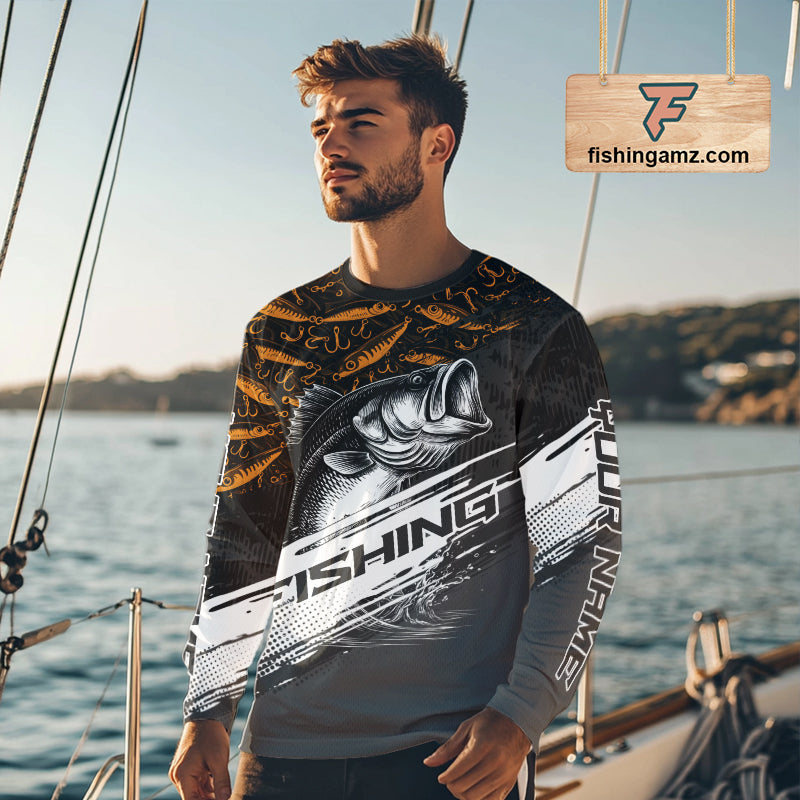 Bass angler wearing personalized black yellow long sleeve fishing shirt on a boat