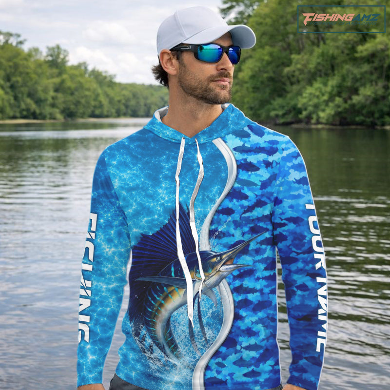 Angler wearing Sailfish fishing blue ocean camouflage performance long sleeve fishing shirt on the water