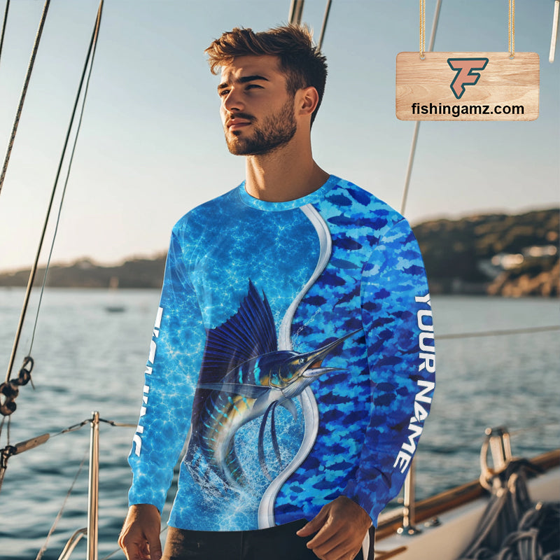 Angler wearing Sailfish fishing blue ocean camouflage performance long sleeve hooded fishing shirt on the water