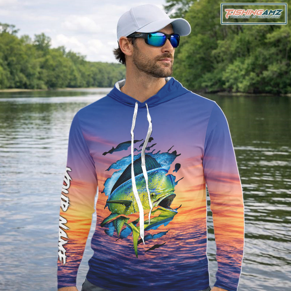 Angler wearing Mahi Mahi Fishing Sunset custom long sleeve hooded mahi mahi offshore fishing shirt at sunset
