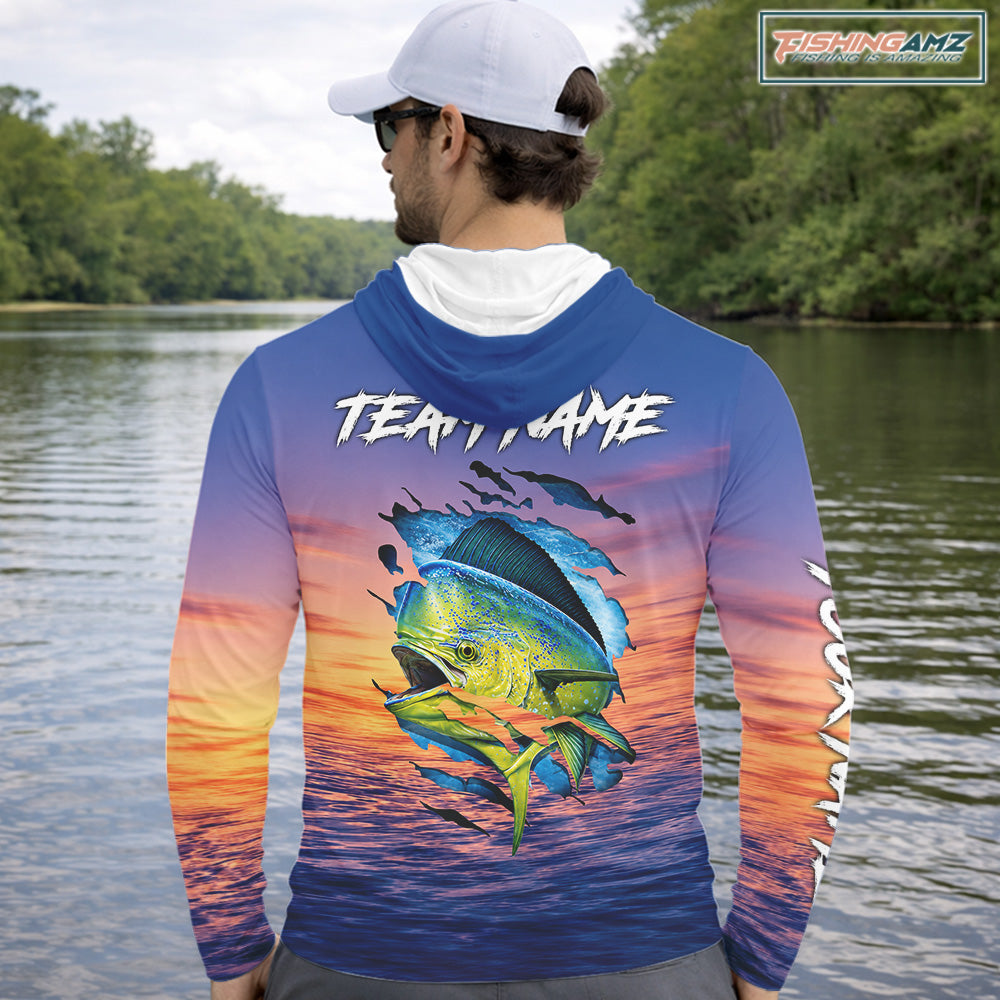 Angler wearing Mahi Mahi Fishing Sunset custom long sleeve hooded mahi mahi offshore fishing shirt at sunset with custom team name on the back