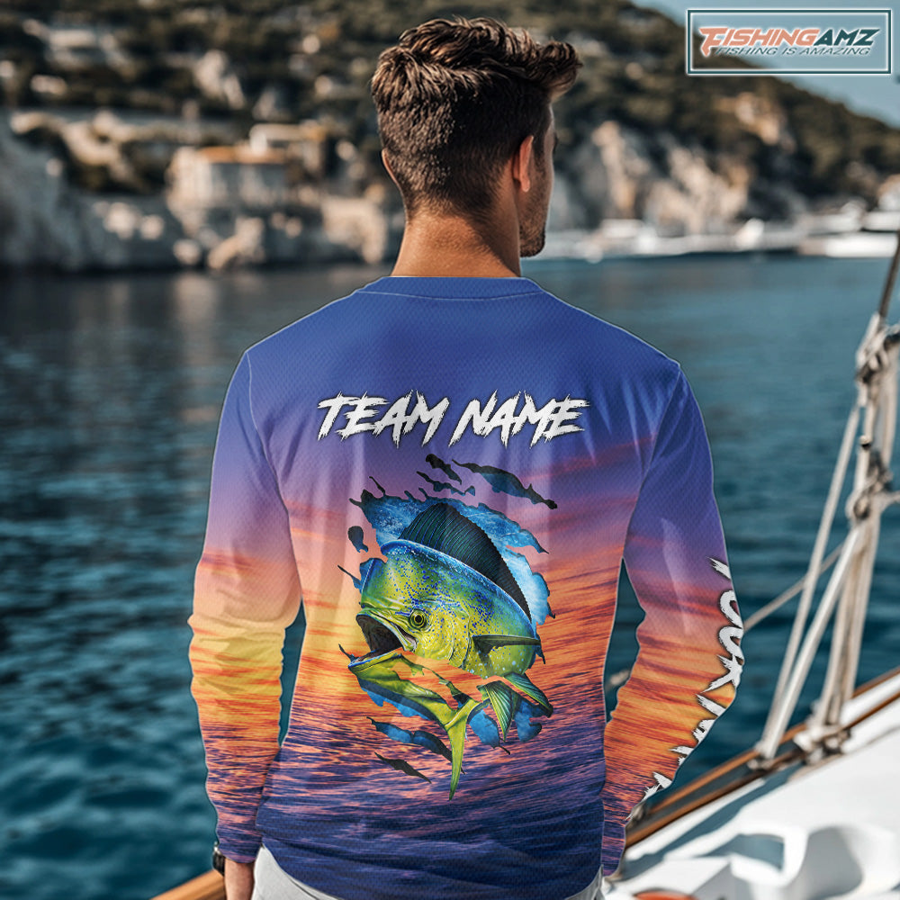 Angler wearing Mahi Mahi Fishing Sunset custom long sleeve mahi mahi offshore fishing shirt on the boat at sunset with personalized name on the back.