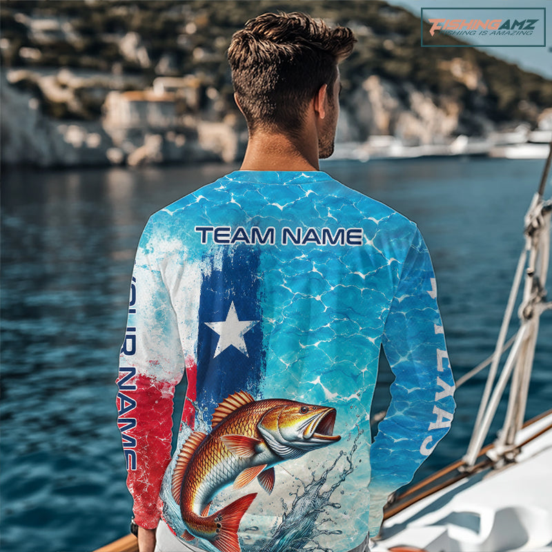 Angler wearing Texas Redfish Fishing Shirt Long Sleeve standing on the boat with team name on the back 