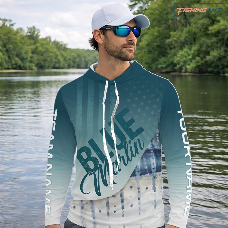 Angler wearing patriotic American Flag Marlin long sleeve hooded fishing shirt on boat
