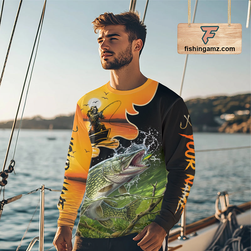 Angler wearing personalized Northern Pike Fish Reaper fishing shirt at sunset