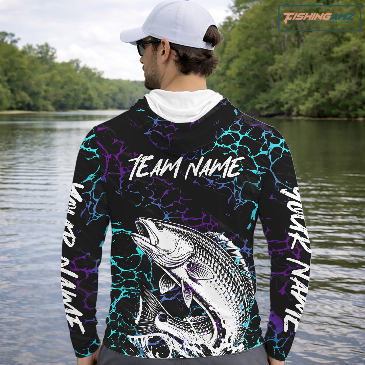 Angler wearing Redfish Fishing neon blue long sleeve hooded saltwater fishing shirt on the boat with personalized name